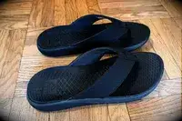 A pair of Reef The Deckhand on a wooden floor