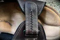 The strap on the top of the Dockers Men