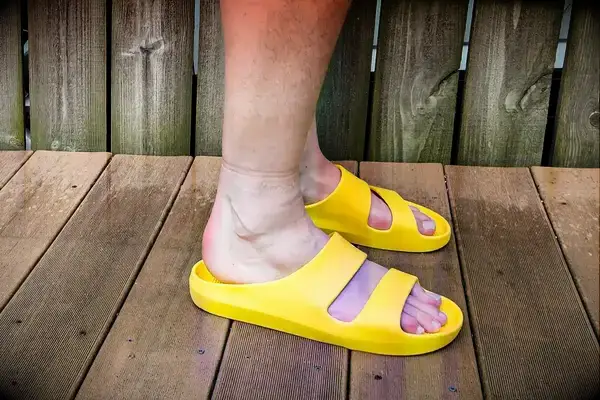 A side view of a person wearing the Bombas Men