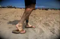 Person wearing Olukai Tuahine Flip Flop at the beach