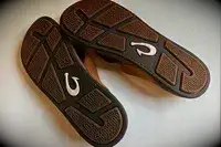 Olukai Tuahine Flip Flop displayed upside down