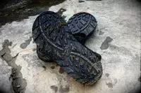 The soles of wet and sandy Chaco Men