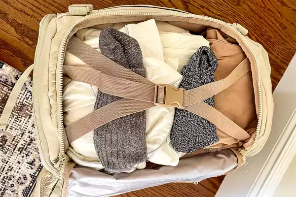 Photo of the inside of a backpack packed with clothes