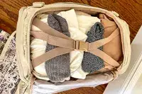 Photo of the inside of a backpack packed with clothes