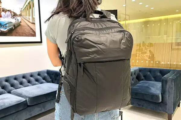 Photo of person wearing a black backpack