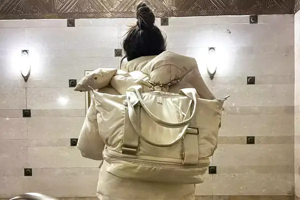 A person wearing the Caraa Sport Tote on their back