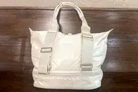 Caraa Sport Tote against a wood background