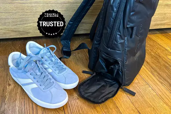 Photo of blue sneakers next to a backpack