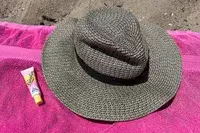 Raen Keera Sunglasses on ground near bottled water