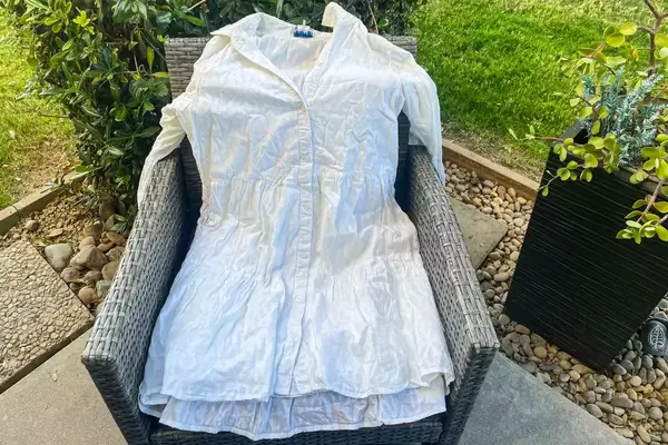 A Tommy Bahama Cotton Clip Jacquard Cover-up Shirt Dress on a chair