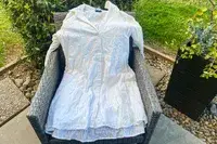 A Tommy Bahama Cotton Clip Jacquard Cover-up Shirt Dress on a chair