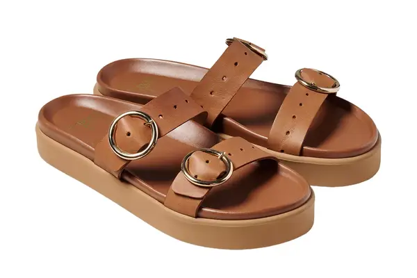 The Longchamp Le Pliage Filet L Mesh Bag on beach sand