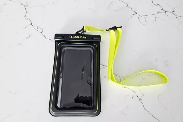 The Case-Mate Pelican Marine IP68 Waterproof Phone Pouch on marble