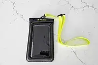 The Case-Mate Pelican Marine IP68 Waterproof Phone Pouch on marble