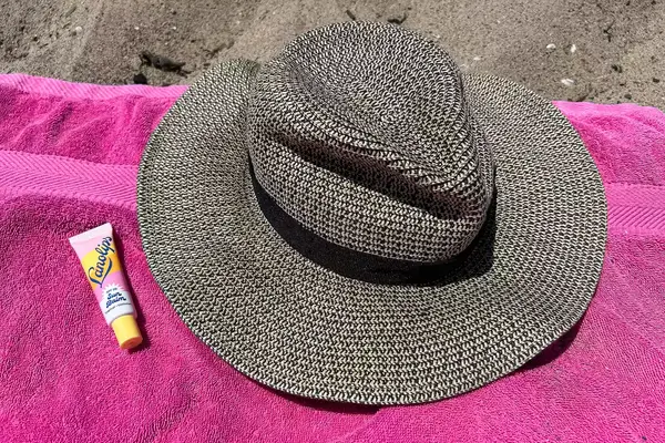 Raen Keera Sunglasses on ground near bottled water