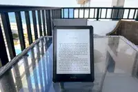 A kindle in the Moko Case for Kindle Paperwhite Origami Standing Shell Cover