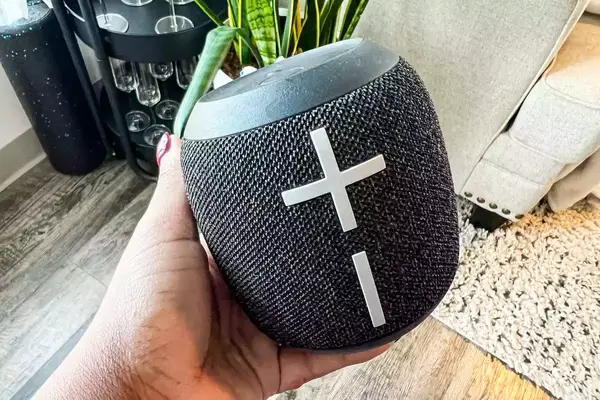 A person holds up the Ultimate Ears Wonderboom 3