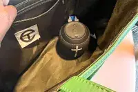 The Ultimate Ears Wonderboom 3 attached to a backpack