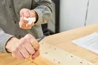 Gerber Gear Truss Multi-Tool is being used to cut the rope