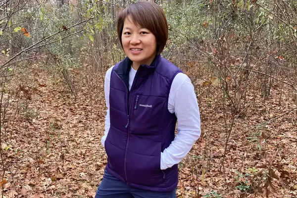 A person wears the Montbell Women’s Thermawrap Vest