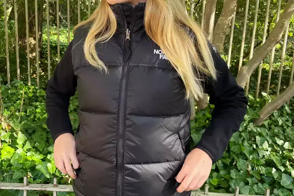 A person wears The North Face 1996 Retro Nuptse Vest Women