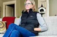 A person sits while wearing the L.L. Bean Women