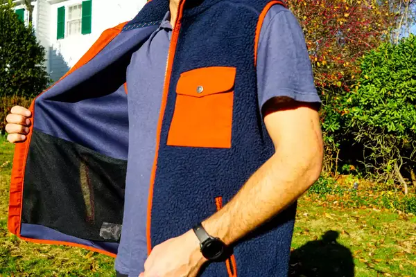 A person holds open the Fjallraven Men’s Vardag Pile Fleece Vest