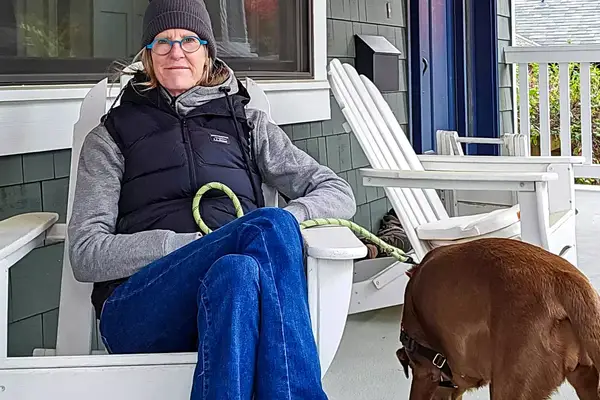 A person sits in a chair while wearing the L.L. Bean Women