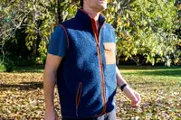 A person wears the Fjallraven Men’s Vardag Pile Fleece Vest