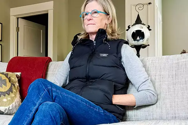 A person sits while wearing the L.L. Bean Women