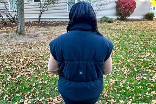 The back of a person wearing the Alo Incline Puffer Vest