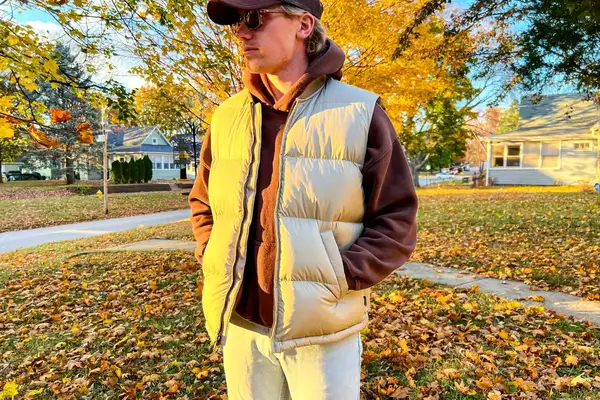 A person stands outside while wearing the Eddie Bauer Men