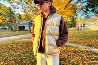 A person stands outside while wearing the Eddie Bauer Men