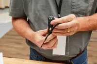 Person holding Nitecore MT21C Rechargeable Flashlight