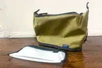 The Thule Aion Toiletry Bag on a table