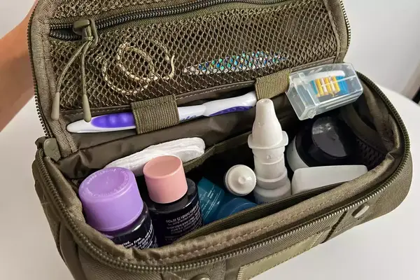 The toiletries inside the Dagne Dover Small Seoul Dopp Kit