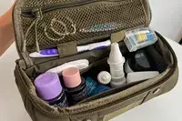 The toiletries inside the Dagne Dover Small Seoul Dopp Kit