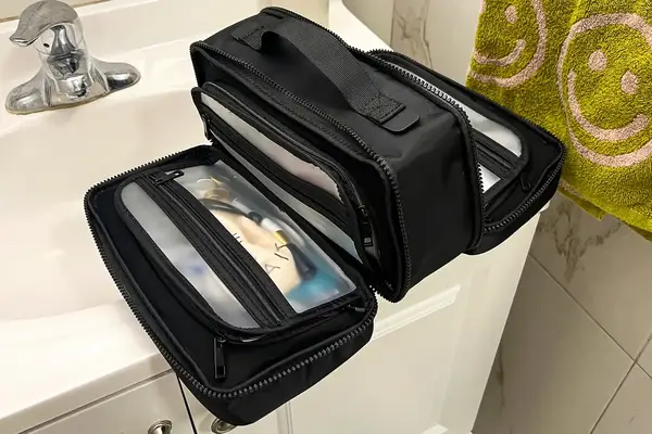The Cincha The Toiletry Bag on a sink