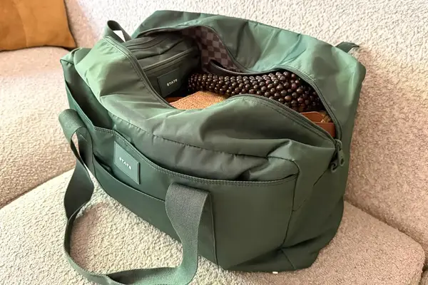 The State Hart Toiletry Kit inside a travel bag from the same company