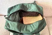 The State Hart Toiletry Kit inside a travel bag