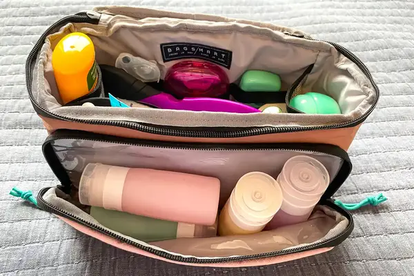 Travel items stored inside the BAGSMART Blast 4.5L Hanging Toiletry Bag
