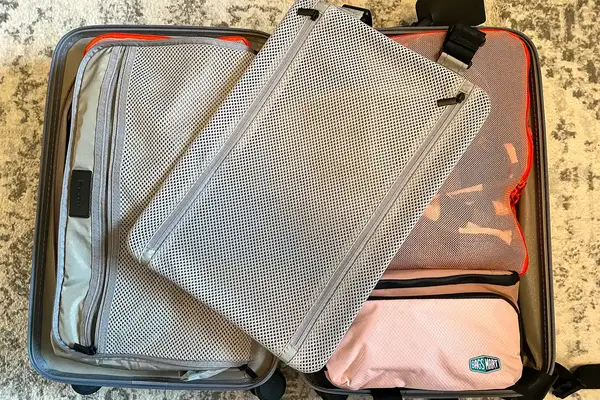 The BAGSMART Blast 4.5L Hanging Toiletry Bag inside a suitcase