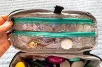 Jewelry and hygiene items stored in the BAGSMART Blast 4.5L Hanging Toiletry Bag