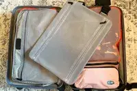 The BAGSMART Blast 4.5L Hanging Toiletry Bag inside a suitcase