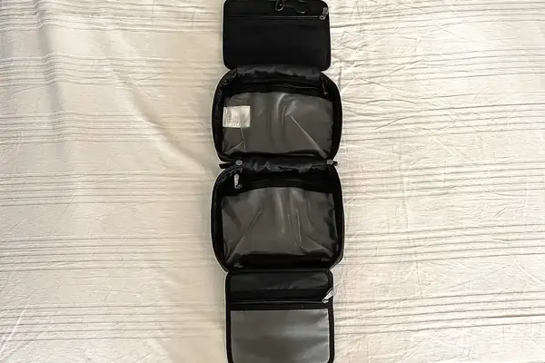 The Antler Hanging Toiletry Bag open on a white sheet