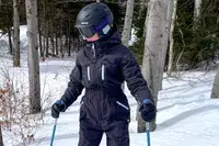 A person on the slopes wearing the Smith Vantage MIPS Snow Helmet