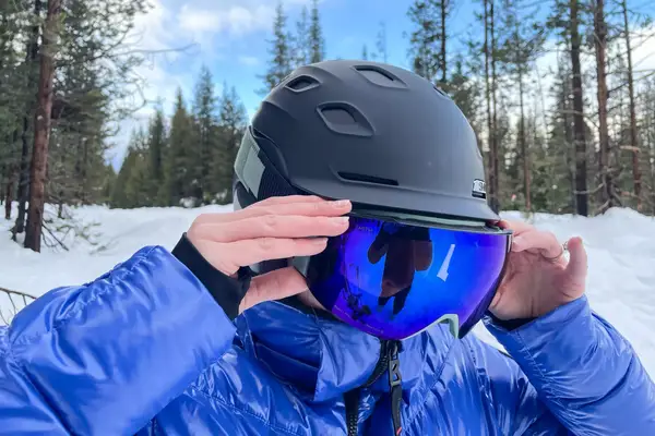 A person wearing the Smith I/O Mag Goggles while skiing