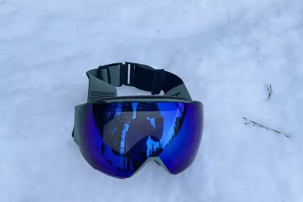 Smith I/O Mag Goggles laying in the snow