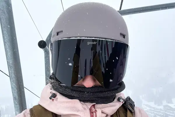 Person in ski gear wears a Turtle Fur Double-layer Neck Warmer