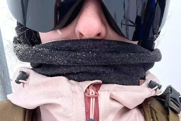 Close-up of a person wearing a Turtle Fur Double-layer Neck Warmer